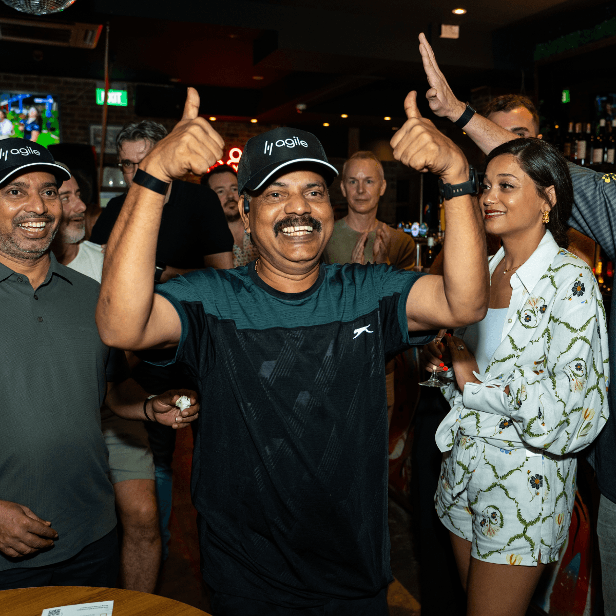 Agile team celebrating at a pre-race party