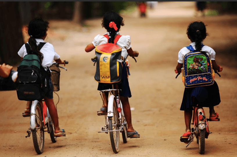 Children riding bicycles to school